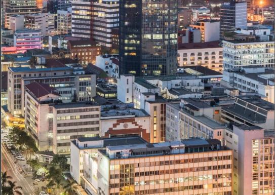 The city lights at dusk create a mesmerizing spectacle, a symphony of human innovation